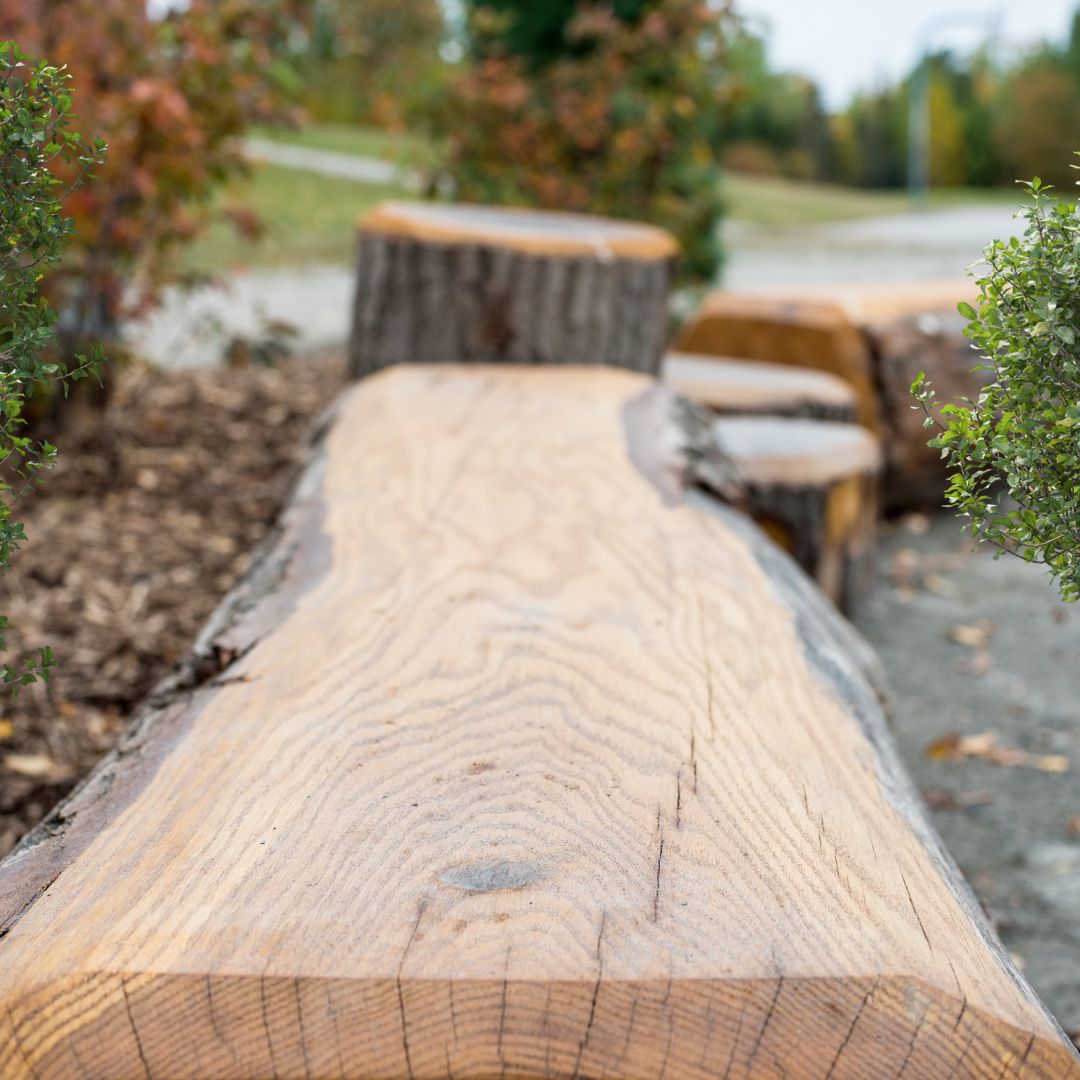 Nature's Instruments log bench outdoor seating 